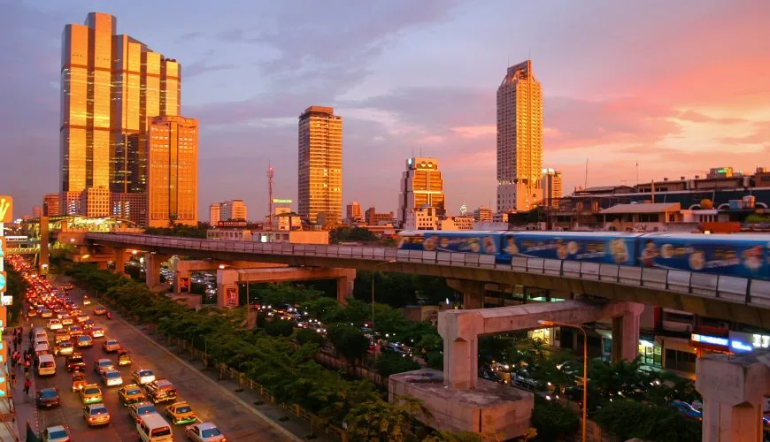 BTS Skytrain above evening traffic in Bangkok