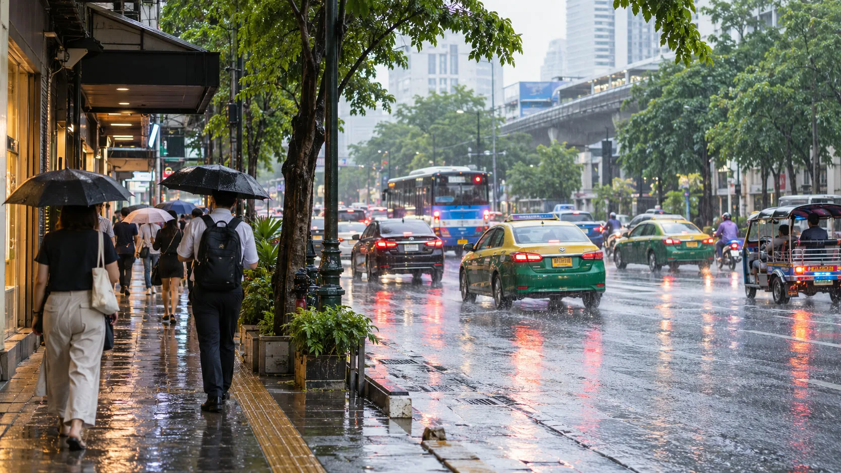 People walking with umbrellas beside Bangkok traffic during a normal tropical rain shower
