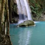 Turquoise pool and limestone cascade at Erawan Waterfall in Kanchanaburi