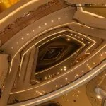 Warmly lit interior atrium of ICONSIAM shopping centre in Bangkok