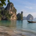 Long-tail boat and limestone coast near Krabi in southern Thailand