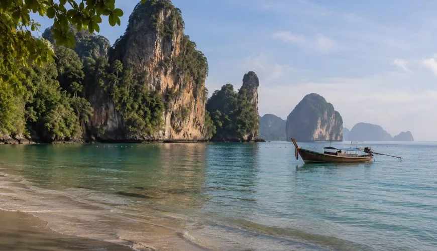 Long-tail boat and limestone coast near Krabi in southern Thailand