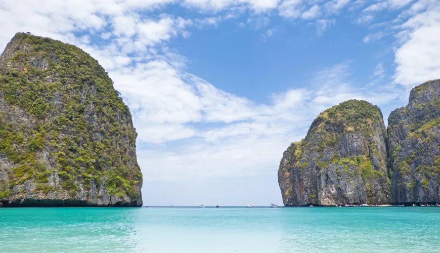 Empty Maya Bay beach framed by limestone cliffs on Phi Phi Leh