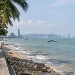 Pattaya seafront with boats and the city skyline viewed from the promenade