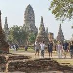 A small private group walking among the historic temple ruins in Ayutthaya