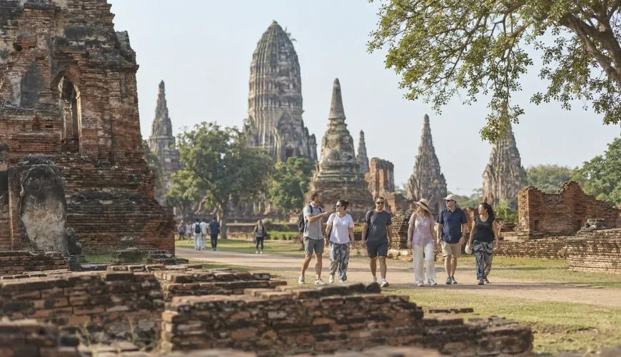 A small private group walking among the historic temple ruins in Ayutthaya