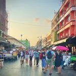 Travellers walking along Khao San Road in Bangkok