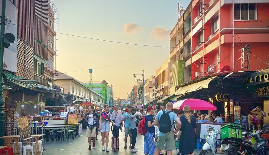Travellers walking along Khao San Road in Bangkok