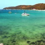 Turquoise water and boats at Tawaen Beach on Koh Larn near Pattaya