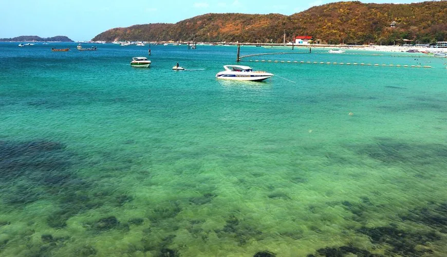 Turquoise water and boats at Tawaen Beach on Koh Larn near Pattaya